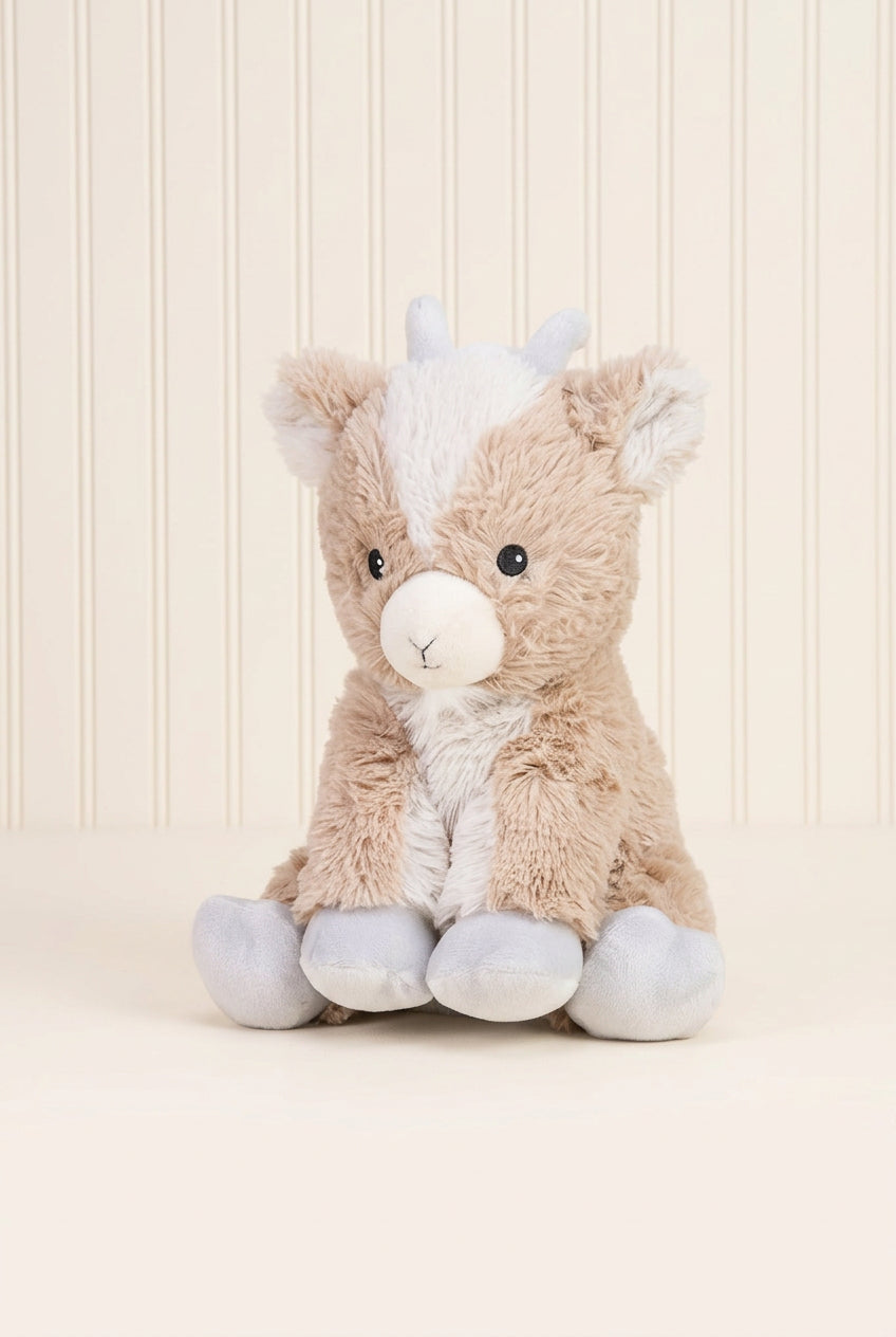 Plush toy goat with a white background