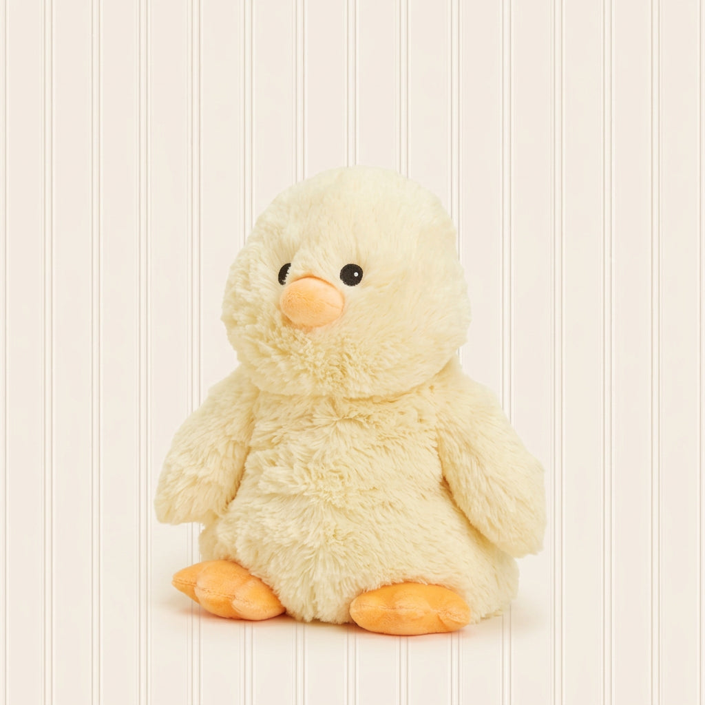 Plush toy chick on a light beige background