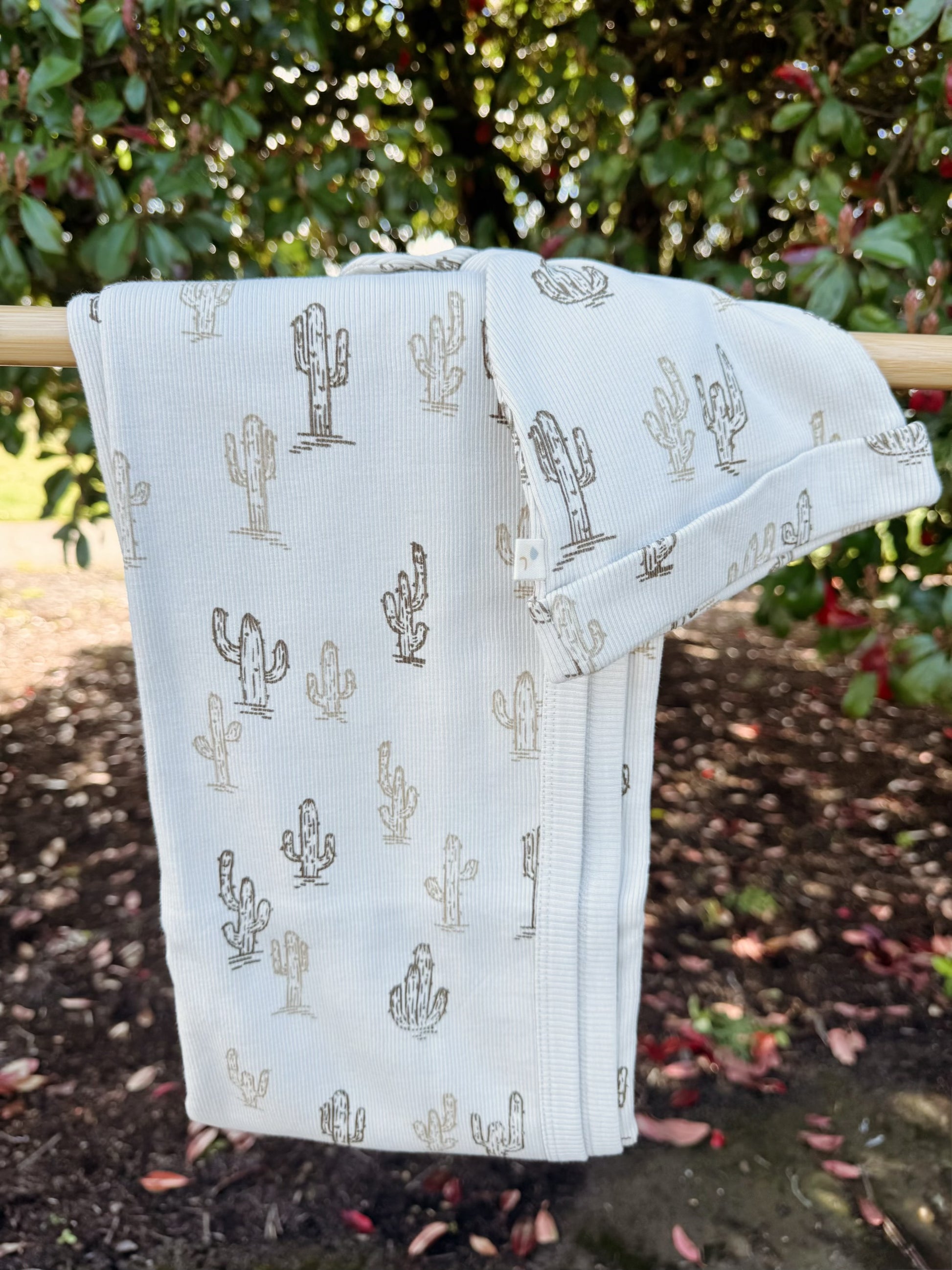 Light cream organic cotton fabric with brown cactus pattern with a batching infant beanie hat