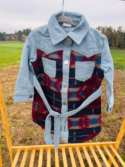 Denim jacket dress with dark red & navy blue aztec pattern, silver button closure up the front and an optional denim tie waist.