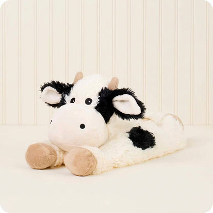 Plush cow toy on a white background